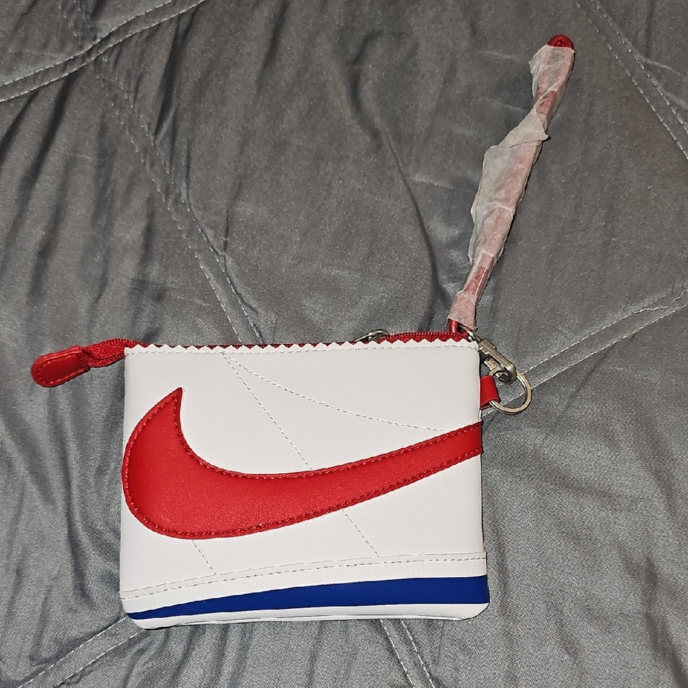 Nike White Wristlet with Red Swoosh and Blue Trim